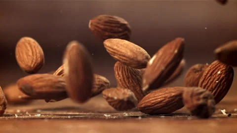 Almonds fall on the table. Filmed on a high-speed camera at 1000 fps. Stock Footage 263291822
