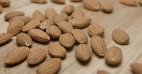 Almonds falling and rotating macro studio Stock Footage 101467195