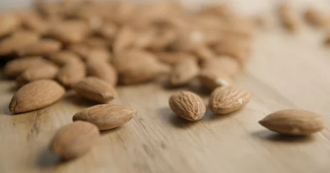 Almonds falling and rotating macro studio Stock-Footage 101467300