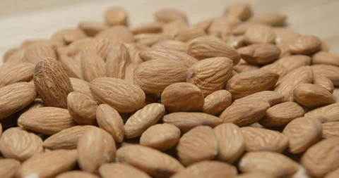 Almonds falling and rotating macro studio Stock Footage 101467699