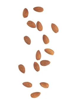 Almonds falling isolated on white background with clipping path Stock Photos