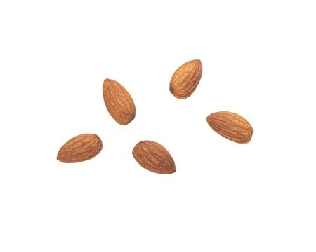 Almonds falling isolated on white background with clipping path Stock Photos