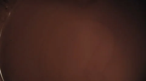 Almonds Falling into Melted Chocolate Stock Footage 51595923