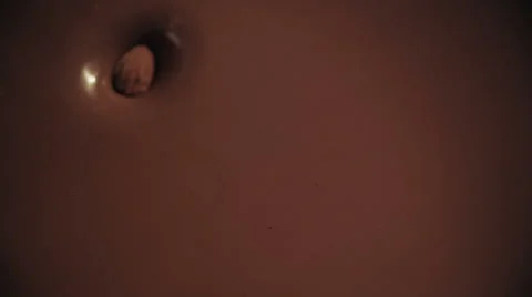 Almonds Falling into Melted Chocolate Stock Footage 51596577