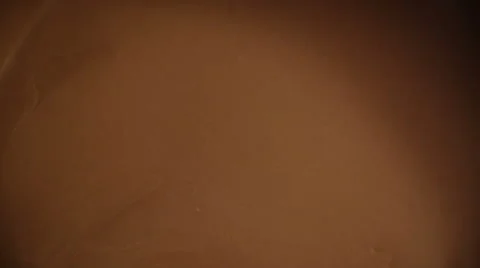 Almonds Falling into Melted Chocolate Stock Footage 51600364