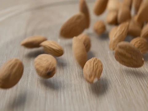 Almonds falling slowmotion studio, orginal file: 4K DCI, PRO RES 444, 12 bits Stock-Footage 81670458