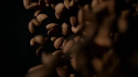 Almonds Flies After Being Exploded against Black Background Video stock 123312668