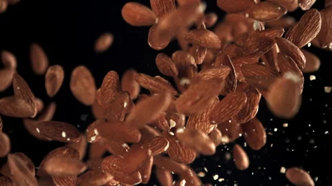 Almonds fly up and fall down. Filmed on ... | Stock Video | Pond5