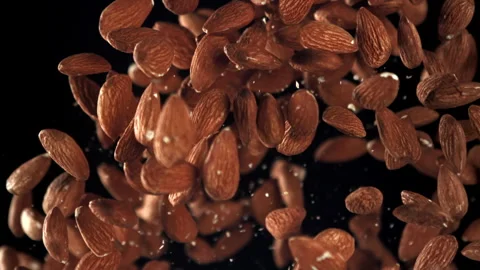 Almonds fly up and fall down. Filmed on ... | Stock Video | Pond5