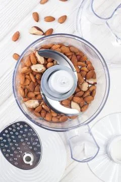 Almonds in a food processor ready to be crushed Stock Photos
