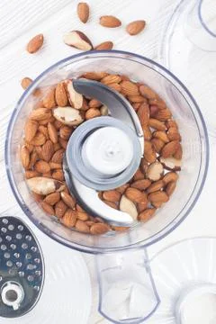 Almonds in a food processor ready to be crushed Stock Photos
