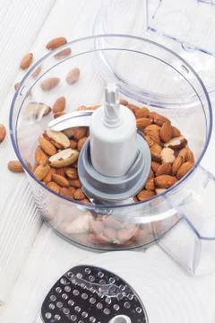 Almonds in a food processor ready to be crushed Stock Photos
