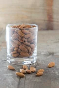 Almonds in a glass Stock Photos