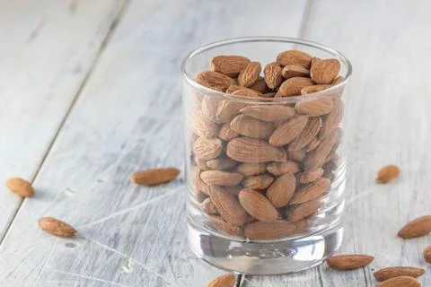 Almonds in a glass Stock Photos