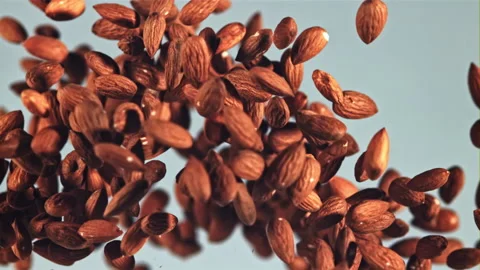 Almonds go up and fall. Filmed is slow motion 1000 fps. Stock Footage 202143218