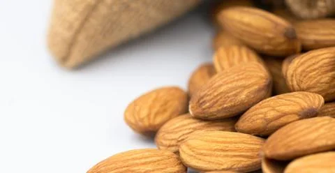 Almonds group on white background Stock Photos