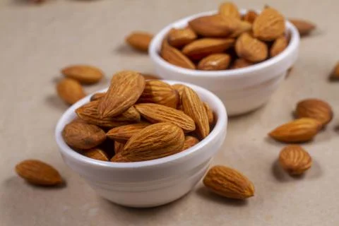 Almonds isolated on light background. Flat lay Stock-Fotos