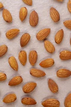 Almonds isolated on light background. Top view. Flat lay Stock Photos