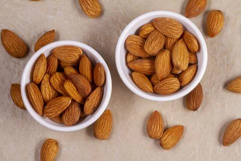 Almonds isolated on light background. Top view. Flat lay Stock-Fotos