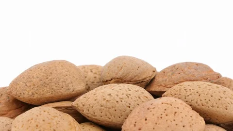 Almonds isolated on white background, rotating Vídeo Stock 87685591