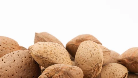 Almonds isolated on white background rotating, studio shot Vídeo Stock 87729937