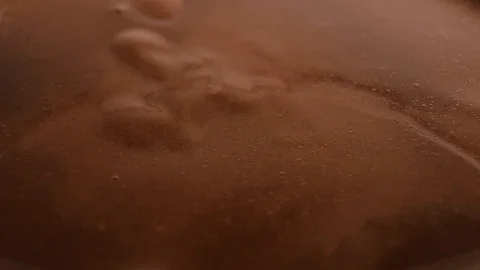 Almonds nuts falling on melted hot chocolate full hd slow motion close-up video. Stock Footage 117837650