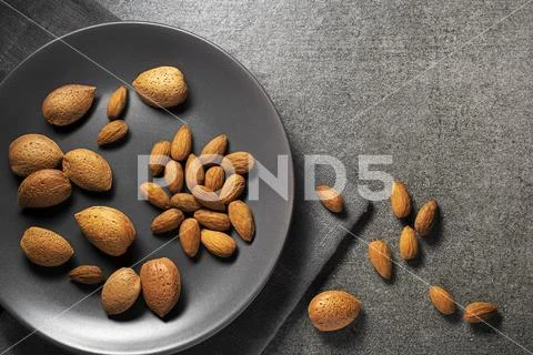 Almonds nuts in gray background Stock Photos