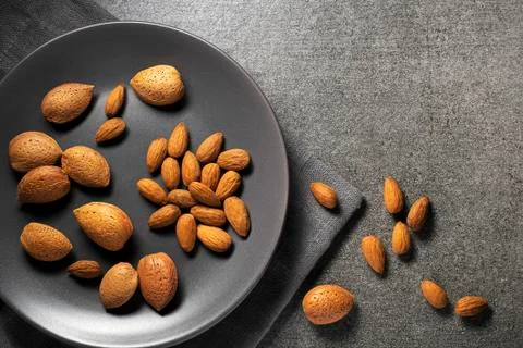 Almonds nuts in gray background Stock Photos