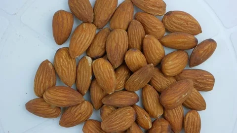 Almonds nuts macro background texture. Almonds nuts closeup rotating. Stock Footage 138831708