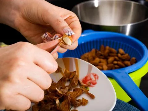 Almonds peeling Stock Photos