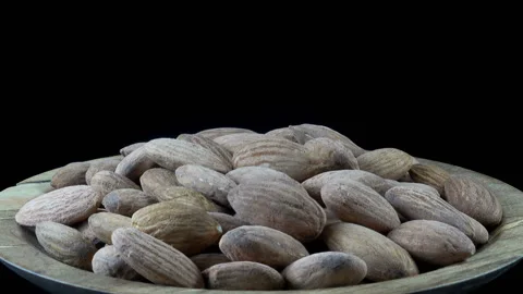 Almonds on a  plate Stock Footage 154748047