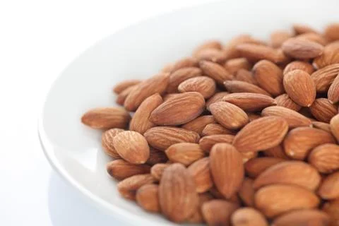 Almonds in a plate Stock Photos