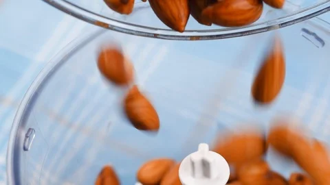 Almonds is pouring in blender, slow motion video 库存影片 124897653
