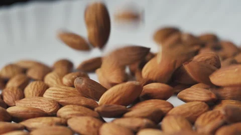 Almonds rotation on the white background - falling -4 Stock Footage 133632409
