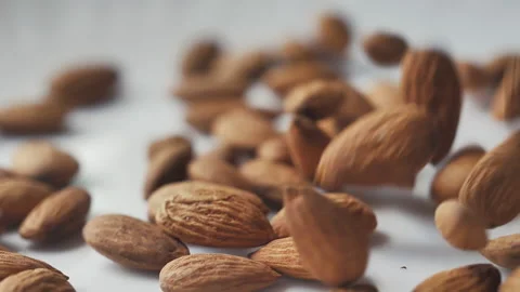 Almonds rotation on the white background - falling -5 Video stock 133632444