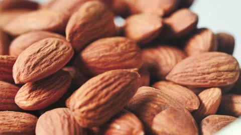 Almonds rotation on the white background - falling -12 Video stock 133632563