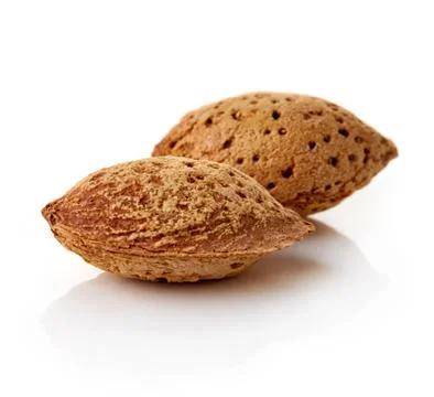 Almonds in shells on white background Foto stock