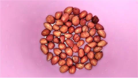 Almonds with space for text in pink background 写真素材