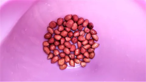 Almonds with space for text in pink background 写真素材