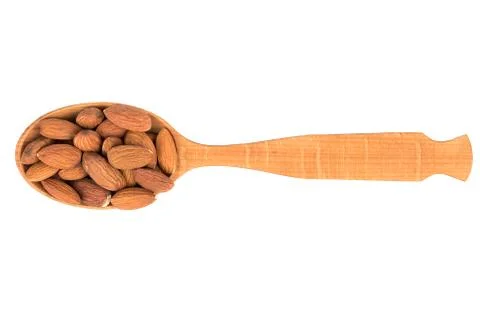 Almonds in a spoon Stock Photos