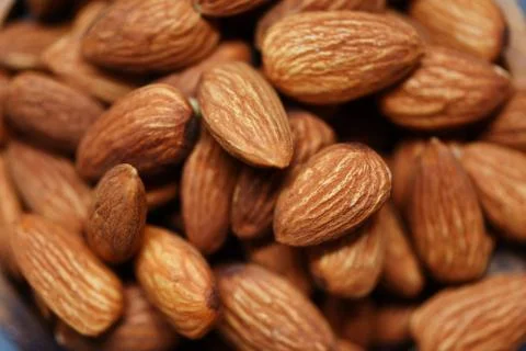 Almonds top view - Close up of roasted almond nuts background Stock Photos