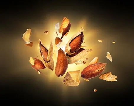Almonds is torn to pieces in the dark Stock Photos