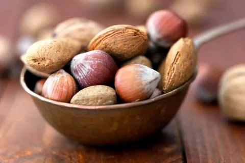 Almonds, walnuts and hazelnuts in metallic bowl 写真素材