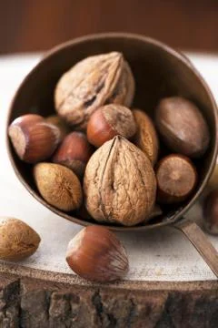 Almonds, walnuts and hazelnuts in metallic bowl 写真素材
