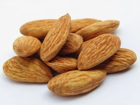 Almonds on white background close-up view Fotos Stock