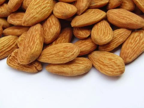 Almonds on white background close-up view  Stock Photos