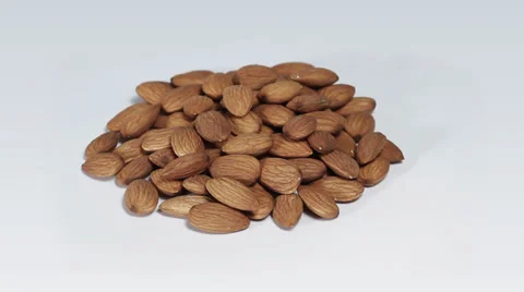 Almonds on white turning close up Stock Footage 33731923