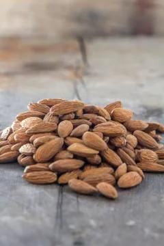 Almonds on wood Stock Photos
