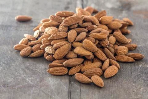 Almonds on wood Stock Photos