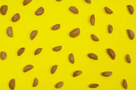 Almonds on yellow background Stock Photos